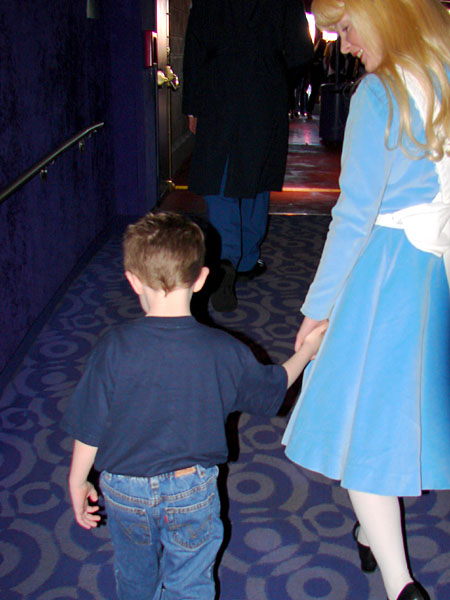 Alice holding Jacob's hand on the way out of the theater (77.87 KB)