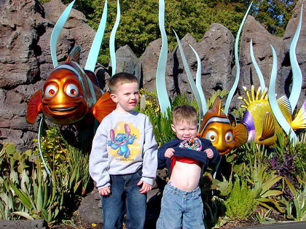 Jacob and a flashing Andrew in front of The Living Seas Pavilion at Epcot (177.37 KB)