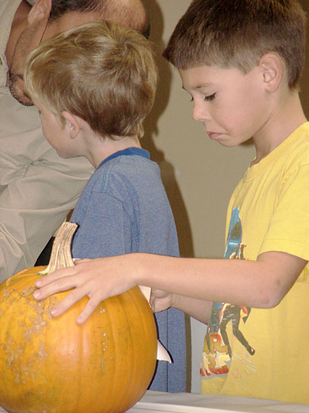 Zach working on his pumpkin (75.83 KB)