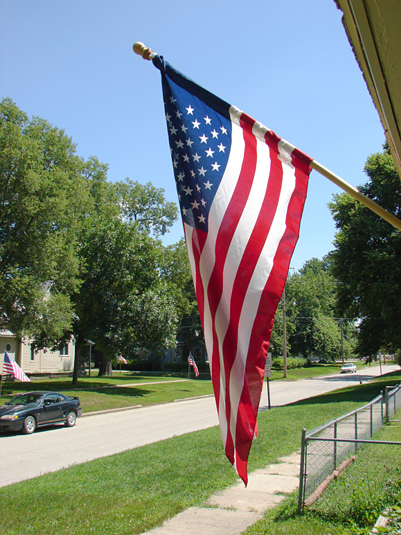 Our flag with flags up down the street (298.59 KB)