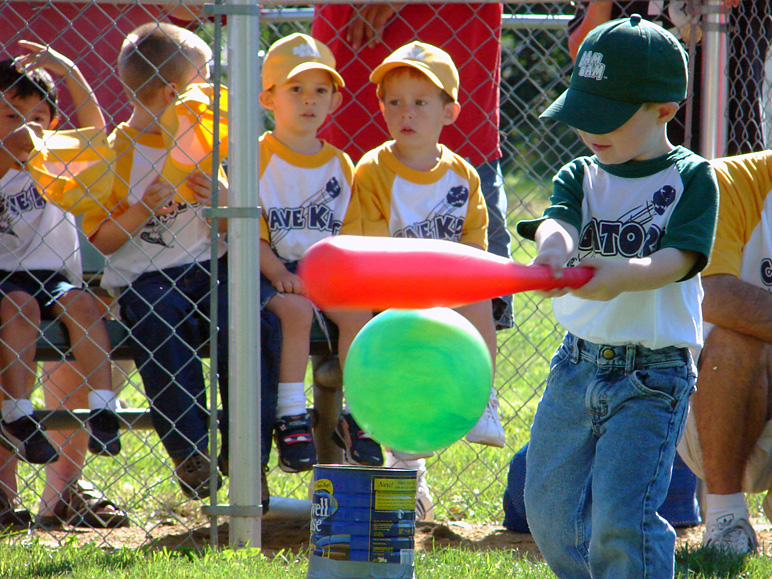 Andrew hitting the ball with observers in the background (315.41 KB)