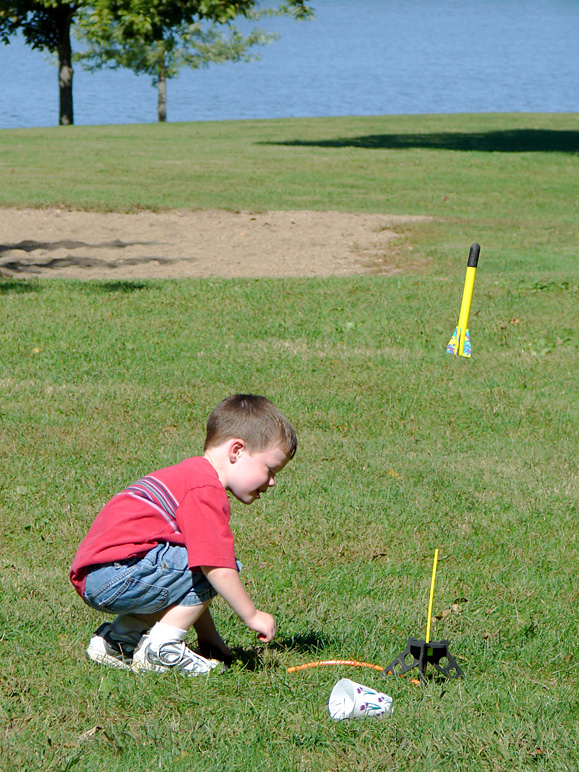 Andrew stomping on his air-powered rocket (314.74 KB)