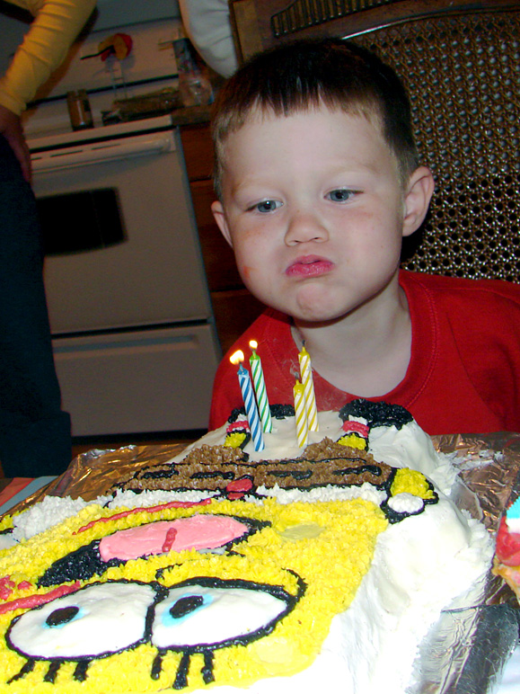 Andrew blowing out his candles, which could've been placed differently (262.90 KB)