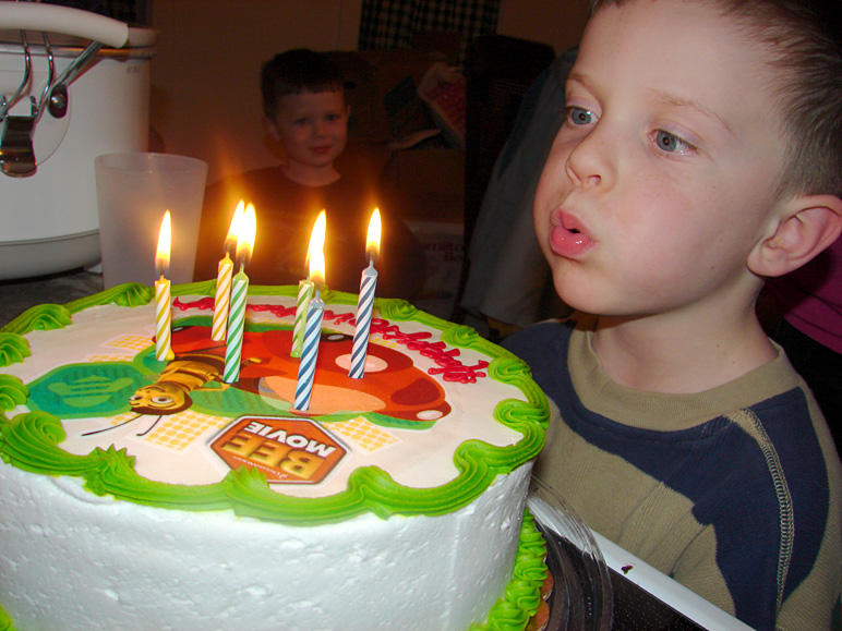 Jacob blowing out the candles on his birthday cake (213.96 KB)