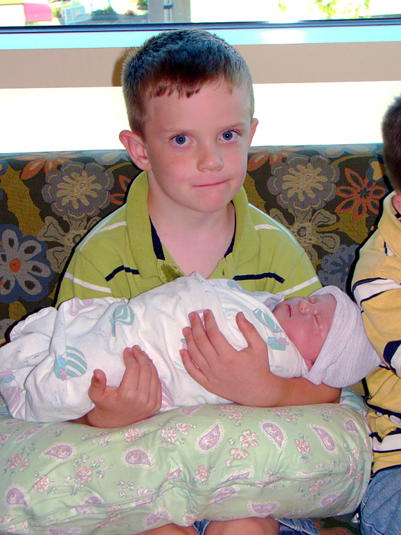 Jacob holding his new sister (247.32 KB)