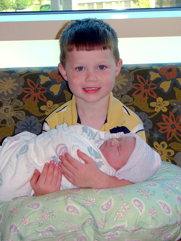 Andrew holding his new sister (238.42 KB)