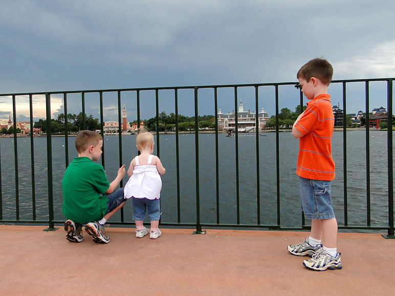 The kids looking out at World Showcase Lagoon (207.36 KB)