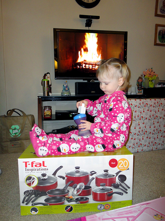 Katelyn sitting atop Anna's new cookware (253.10 KB)