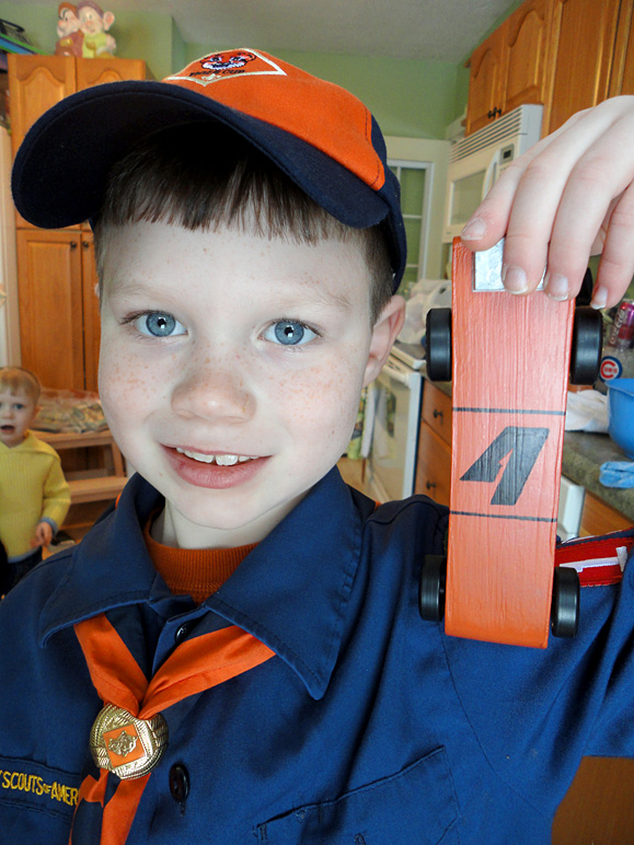 Andrew showing off his Pinewood Derby car (214.76 KB)