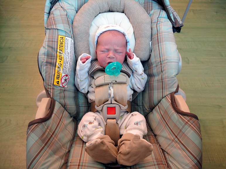 He looks hilariously tiny in his car seat (239.68 KB)