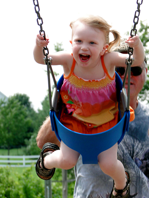 The birthday girl enjoying the swings (176.19 KB)