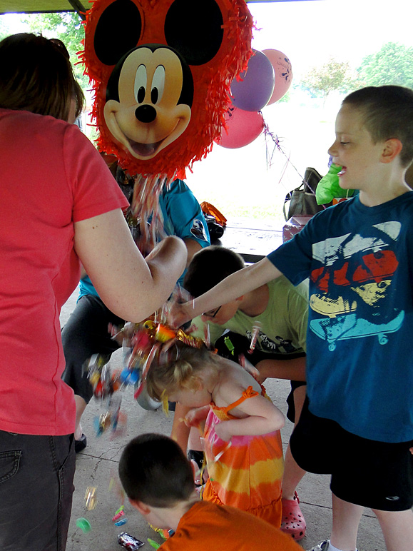 After getting the piñata open, the candy poured over Kate's head (213.75 KB)