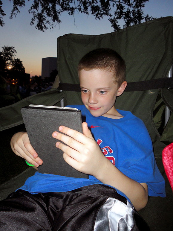 Jake reading on my mom's Kindle (207.22 KB)