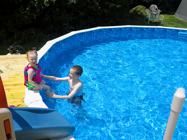 Jake helping Kate into the pool (302.71 KB)