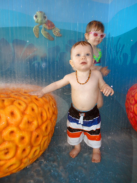 Luke with Kate in the background enjoying the water (207.35 KB)