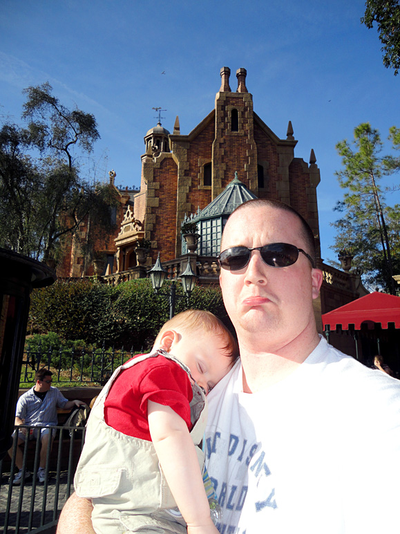 Luke, asleep in front of the Haunted Mansion.  He slept through it, too. (222.30 KB)