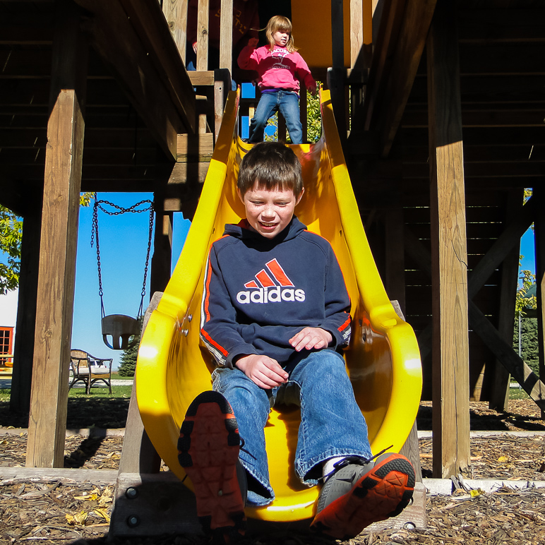 Andrew took a turn down the slide; Kate's waiting at the top. (404.62 KB)