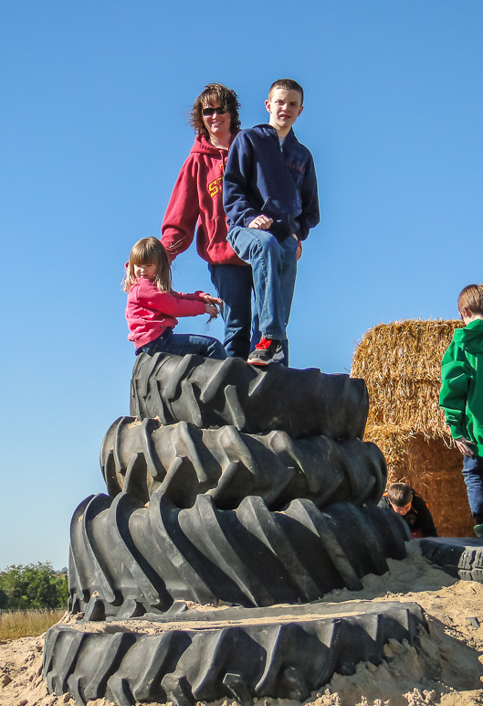 Katelyn, Anna and Jacob climbed atop these tires. (238.99 KB)